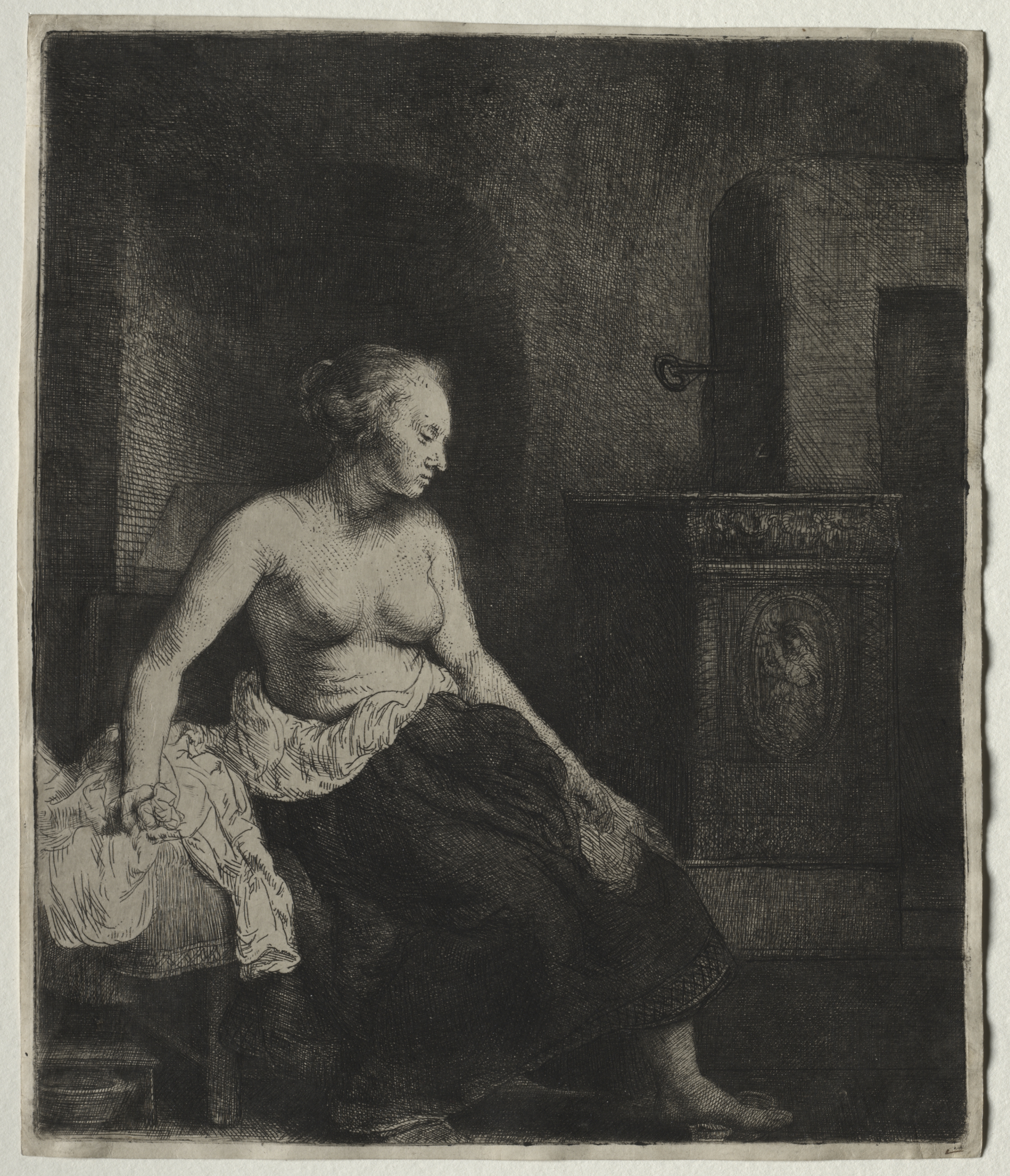 Woman Sitting Half Dressed Beside a Stove by Rembrandt van Rijn at Cleveland Museum of Art